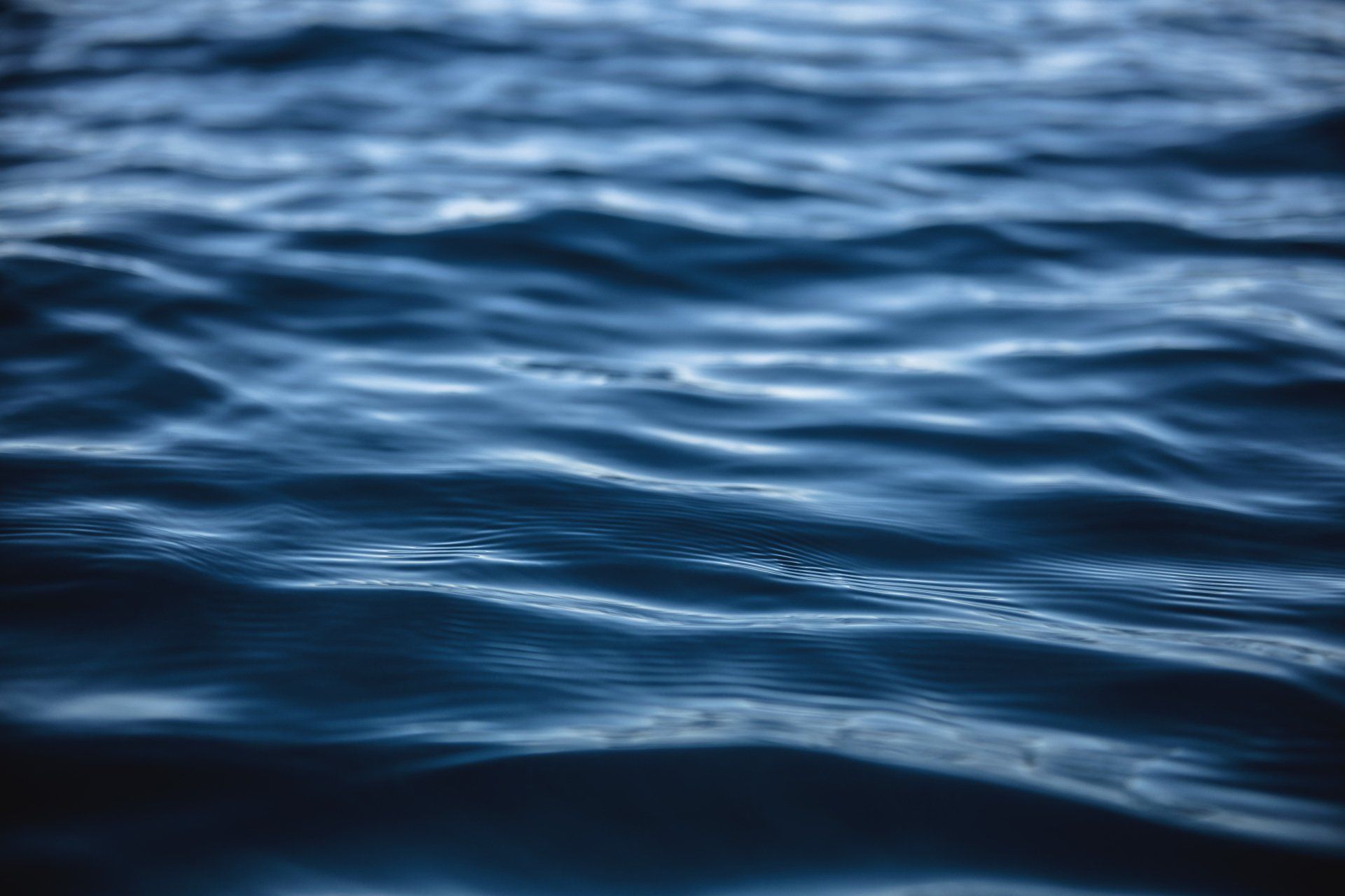 A close up of a body of water with waves