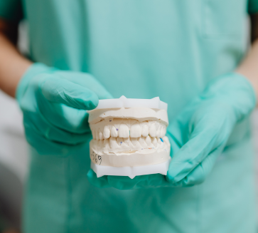 Man holding denture