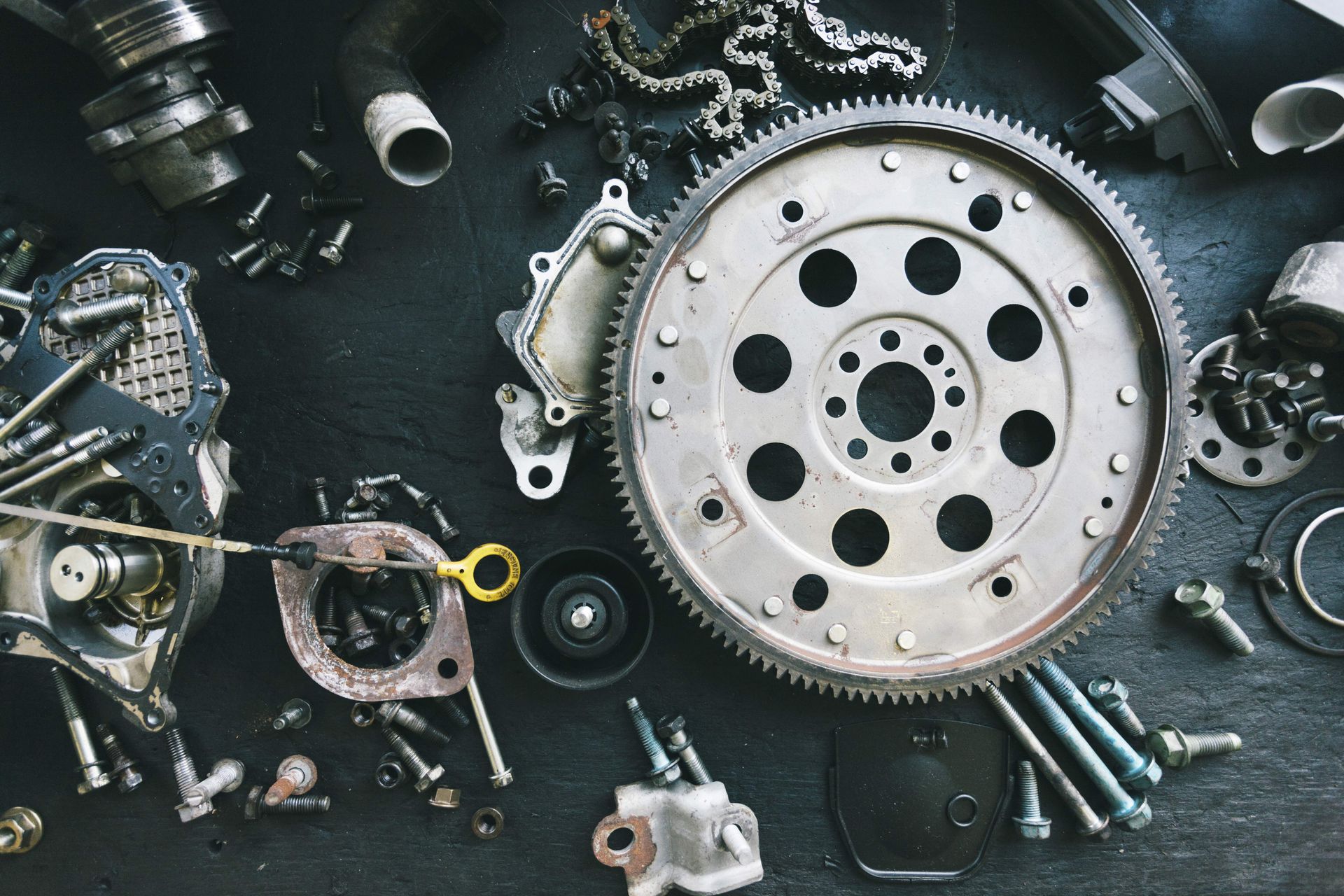 Car parts displayed on a workbench. Car parts displayed on a workbench.
