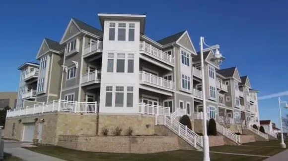 A Large Apartment Building with Stairs Leading up To It | Sheboygan, WI | Elite Builds