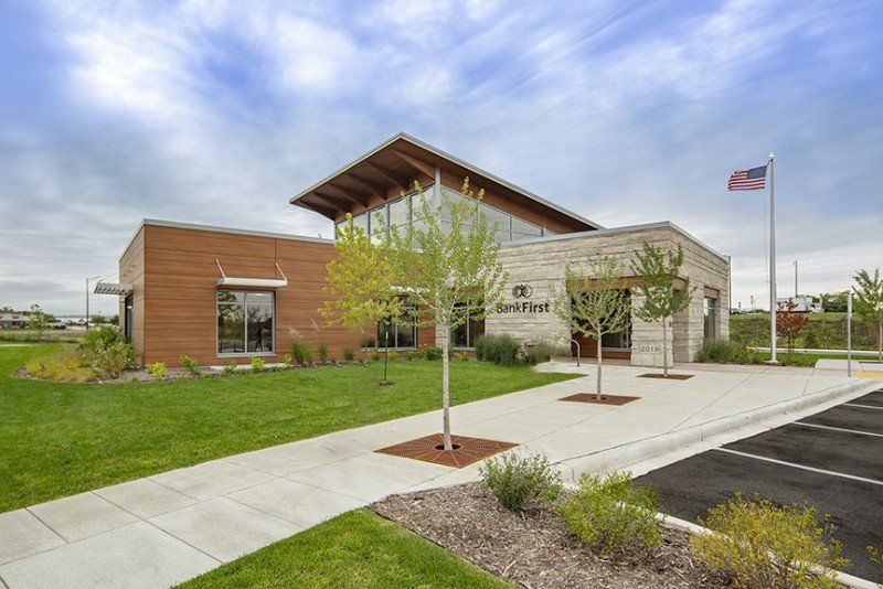 A Large Building with A Flag in Front of It | Sheboygan, WI | Elite Builds