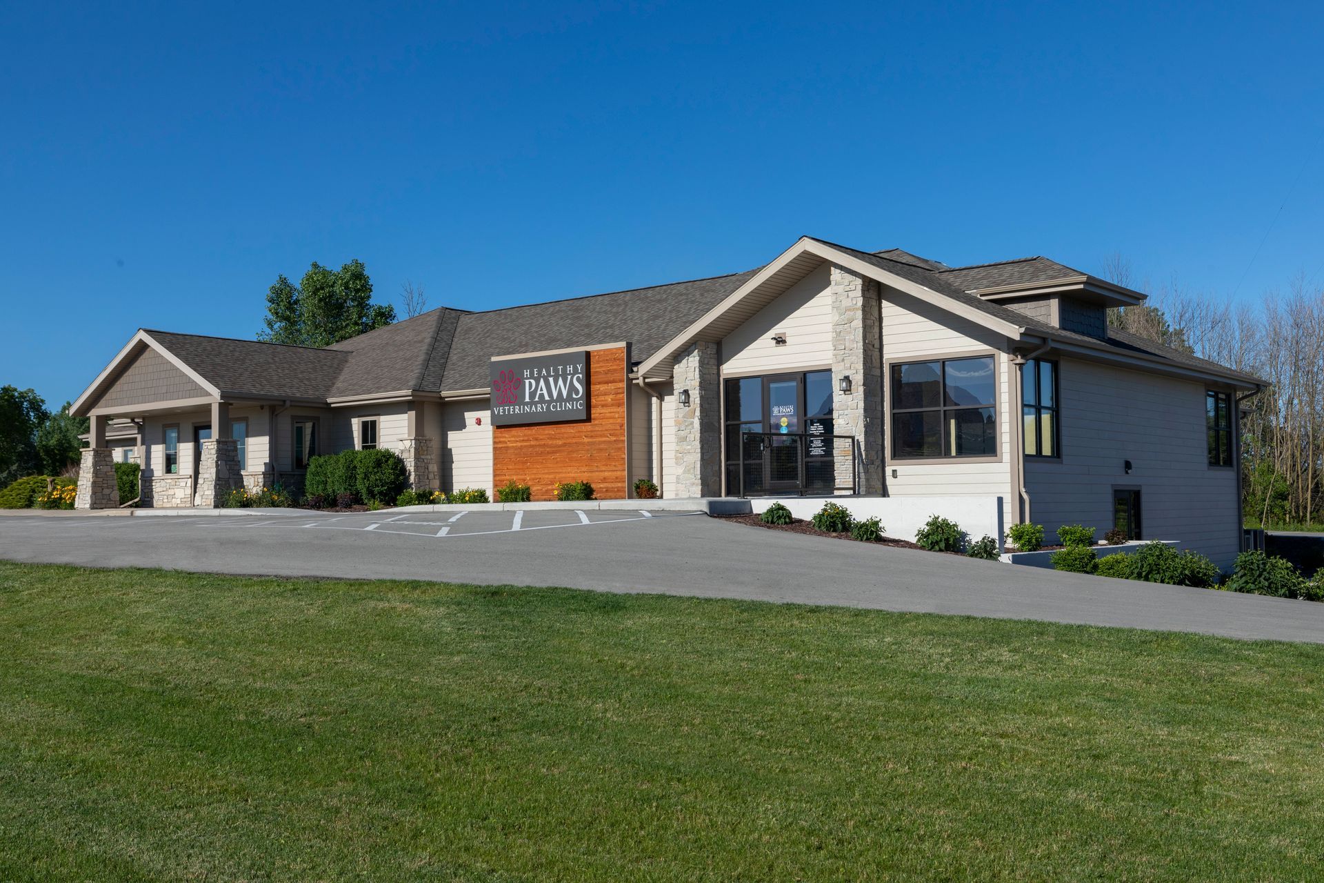 A Small White Building with A Red Roof and A Handicapped Parking Spot in Front of It | Sheboygan, WI | Elite Builds