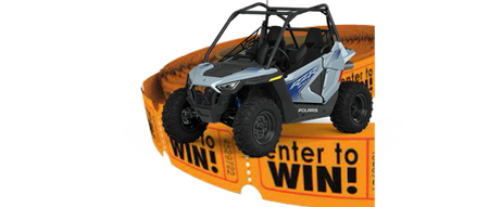 A toy atv is sitting on top of a ticket that says enter to win.