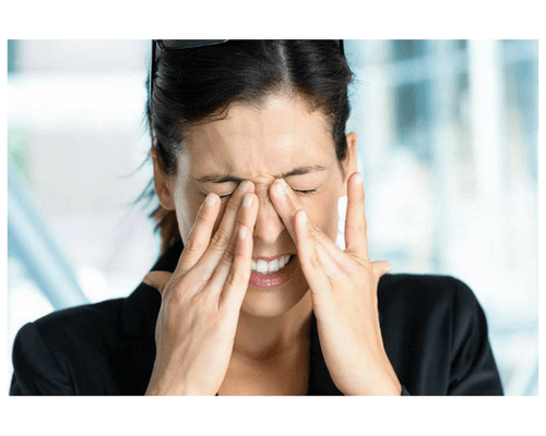 woman suffering from eye problems