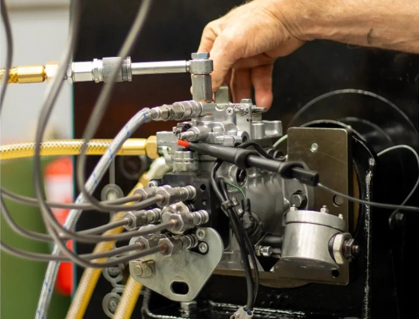 A close up of a person working on a machine