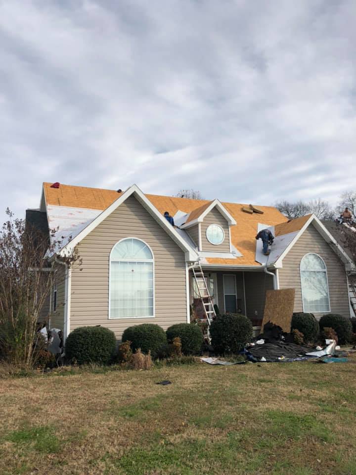 A house is being remodeled with a new roof being installed.