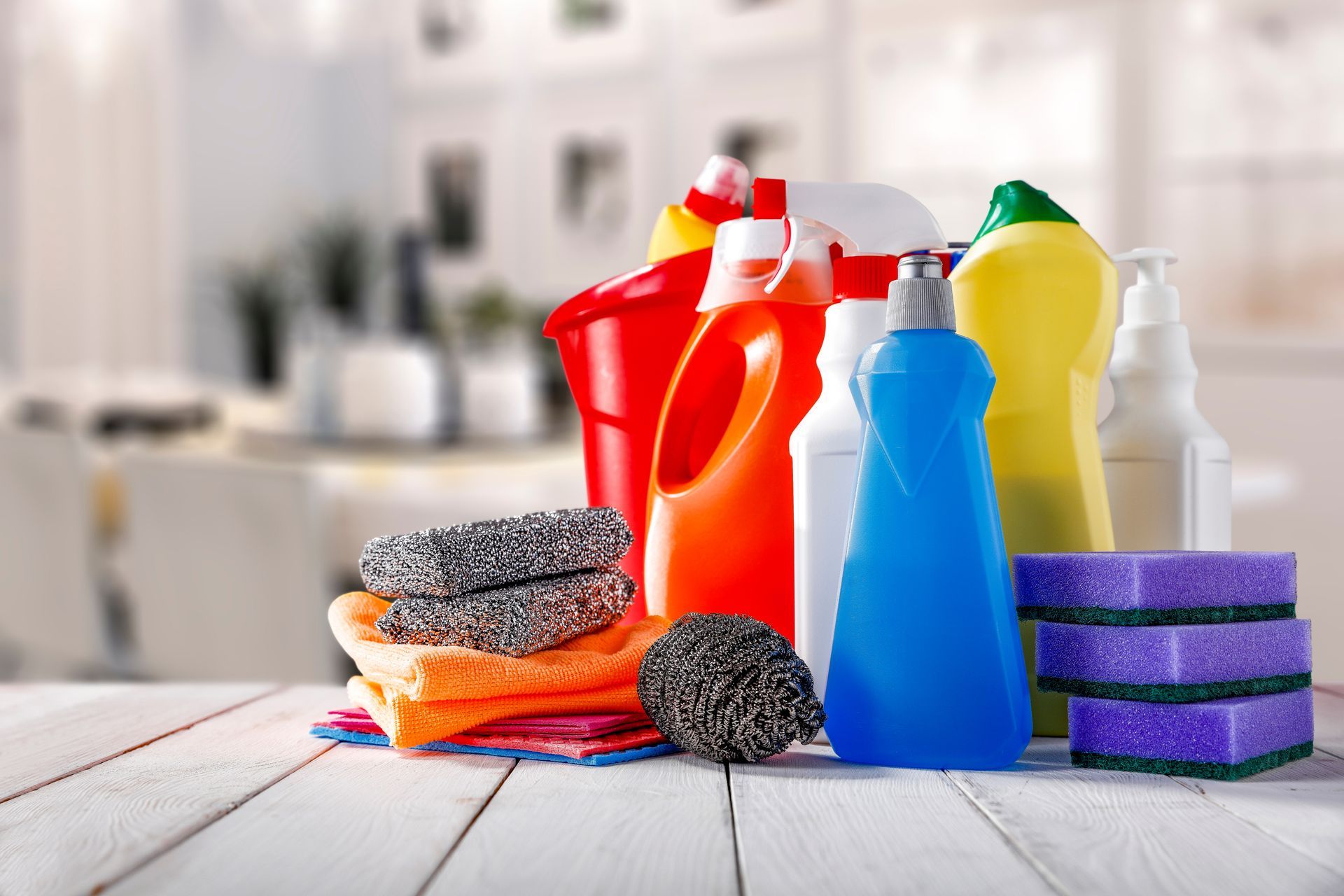 View of colourful products over a table showcasing commercial cleaning supplies.