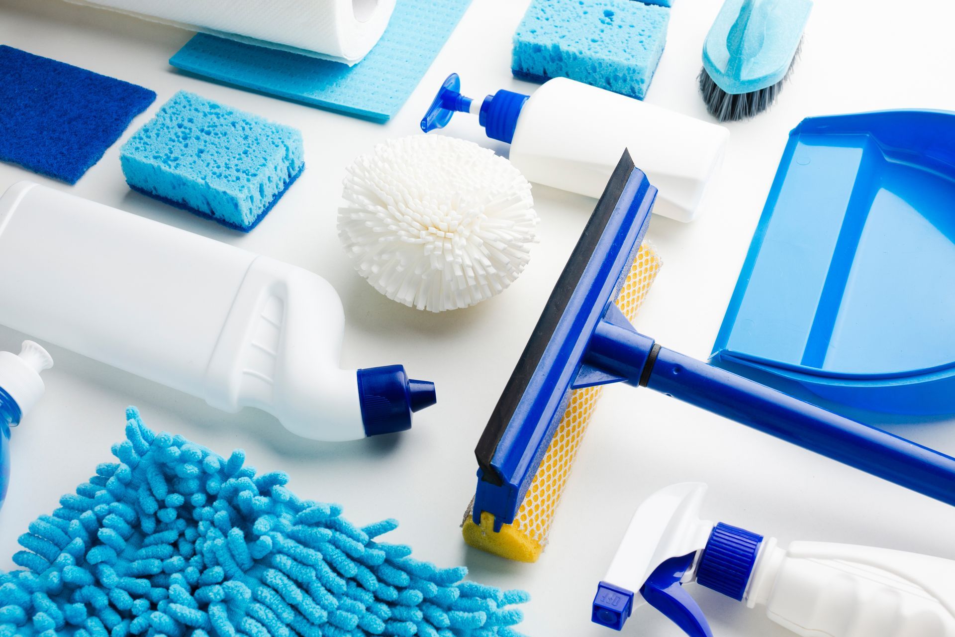 Close-up of white and blue commercial cleaning products.