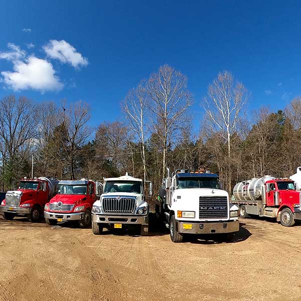 Row of Trucks — Coldwater, MS — A-1 Septic Tank & Drain Service LLC