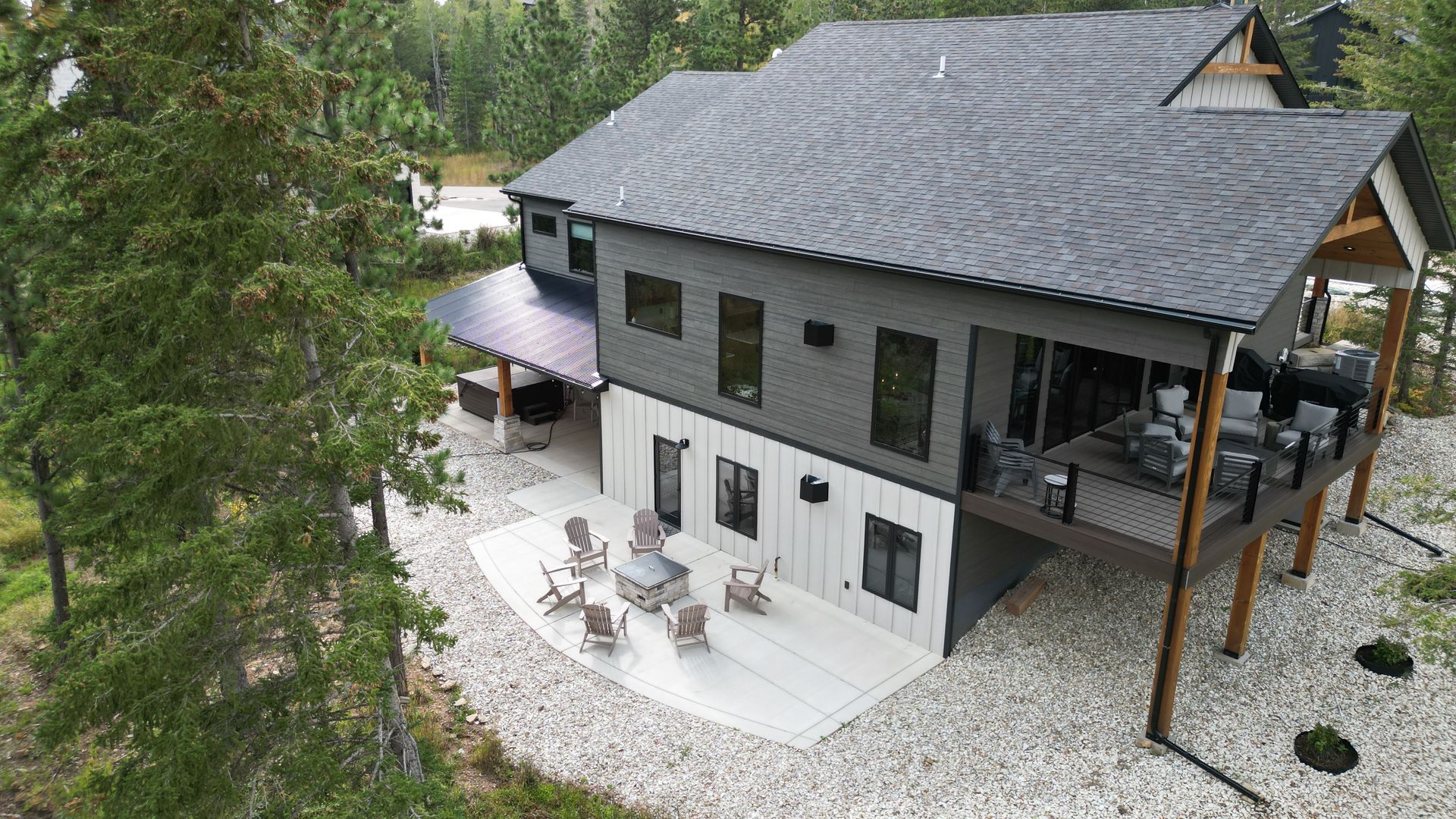A concrete patio is being built in front of a house.