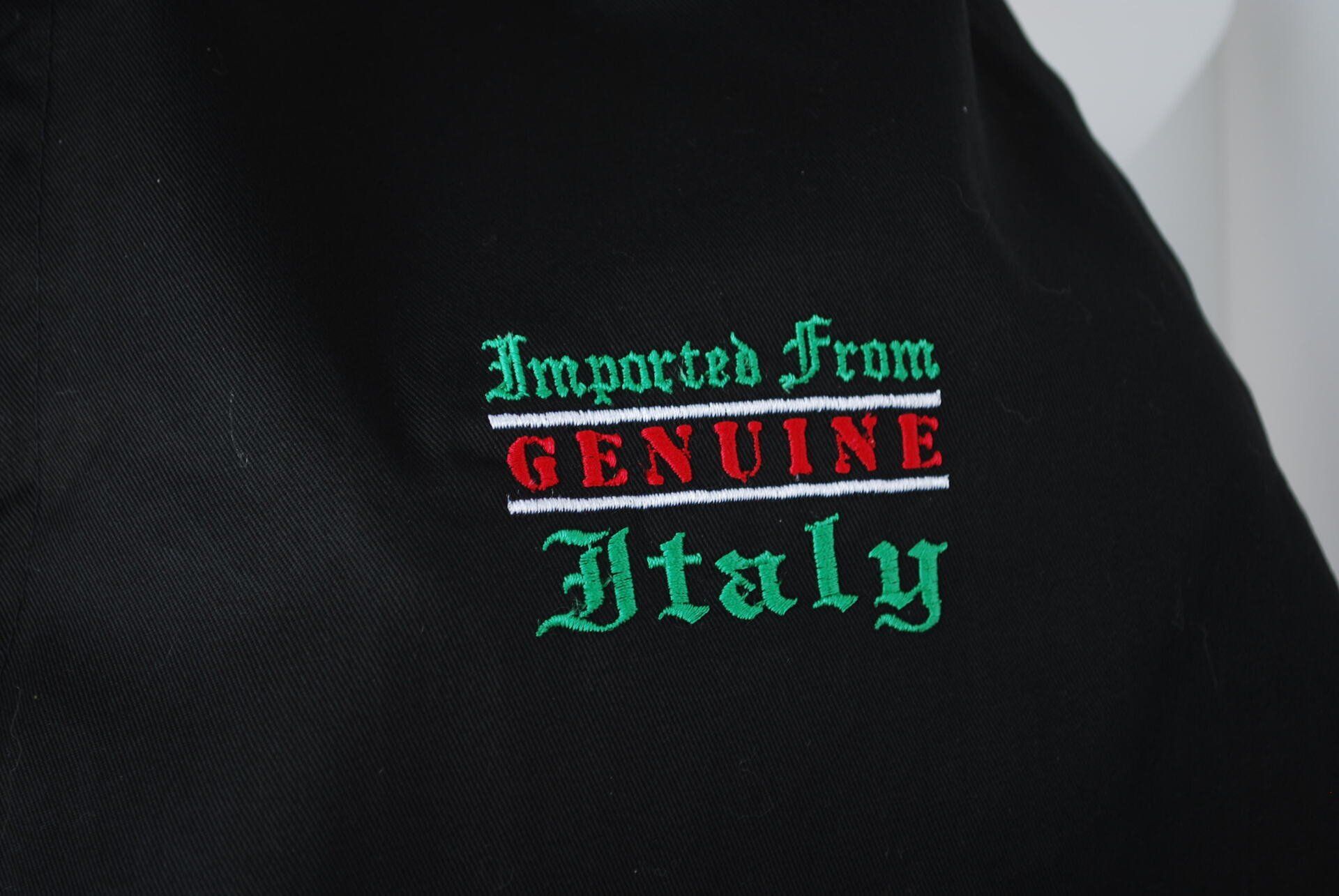 Embroidered logo on black apparel
