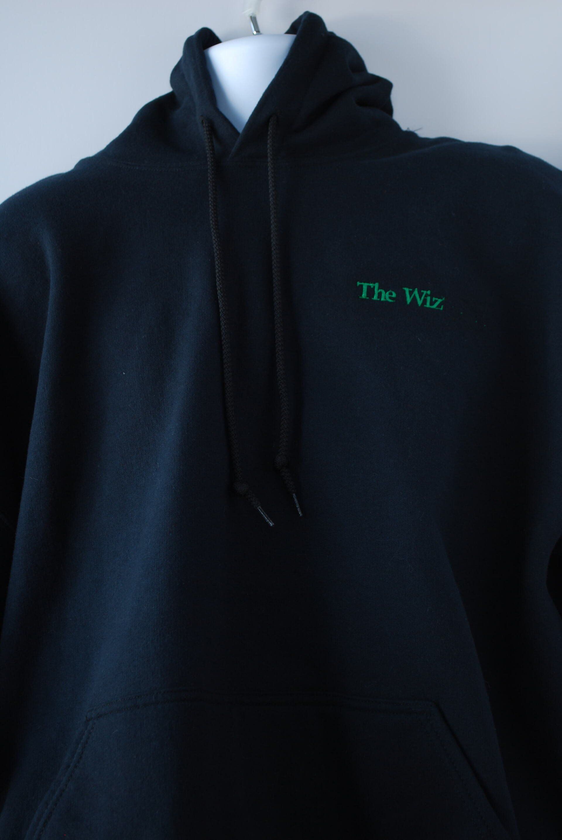 A black hoodie with The Wiz logo on it