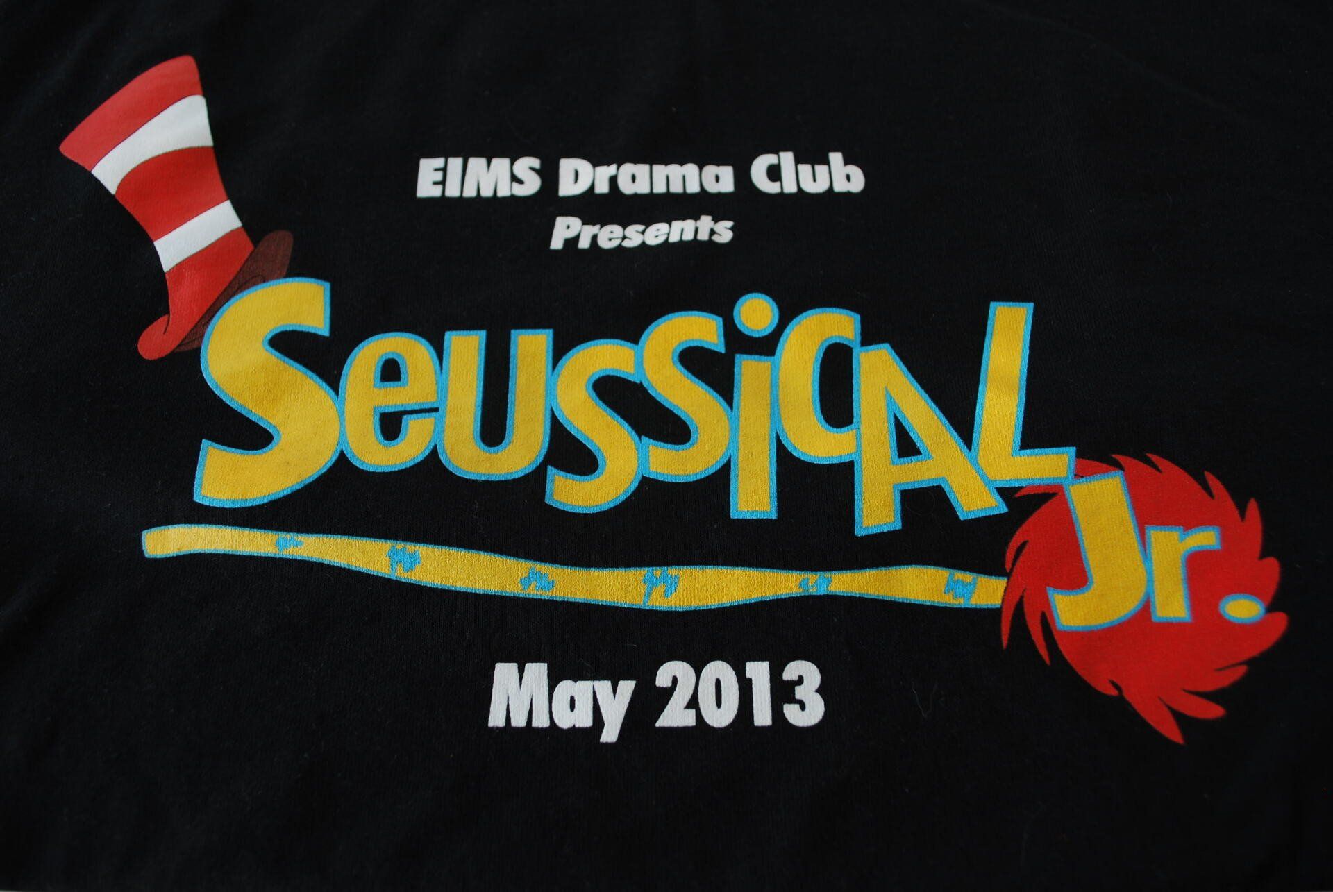 A black shirt that saysSeussical JR May 2013