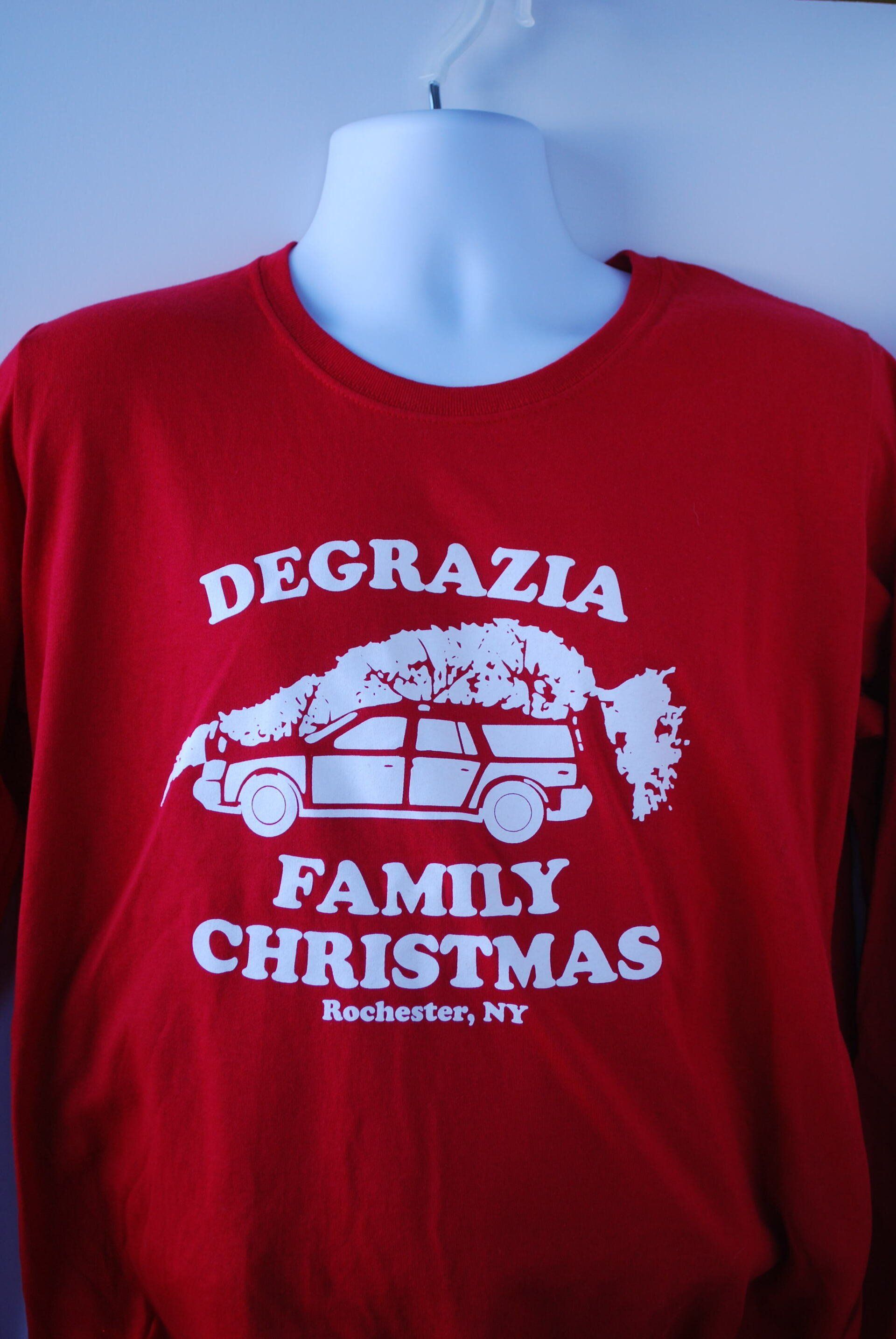 A red shirt that says Degrazia Family Christmas