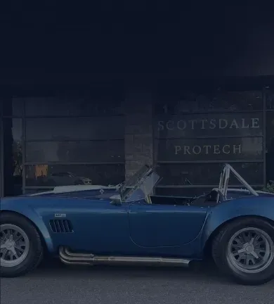 Blue classic car parked in front of a building | Scottsdale ProTech
