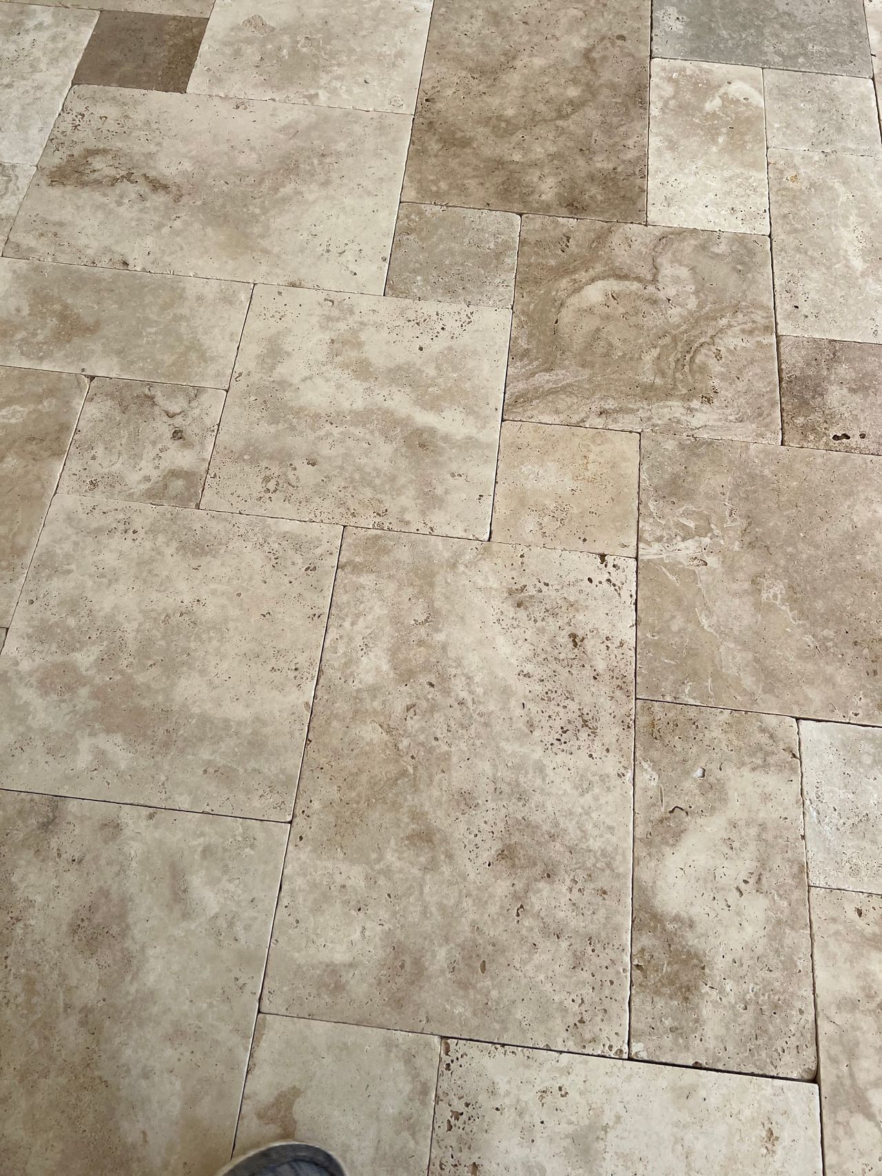 A natural travertine deck.