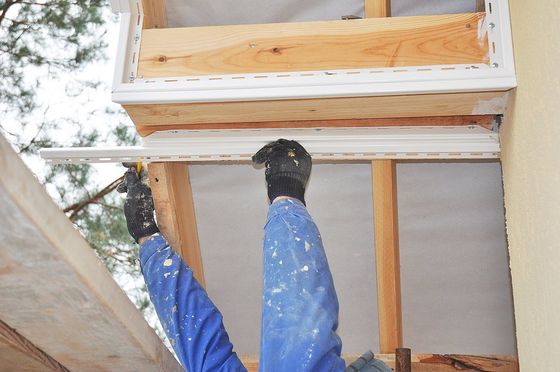 worker fixing the ceiling