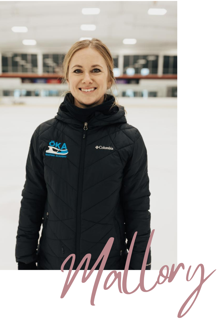 Woman smiling in front of an ice rink, wearing a black jacket with a logo.