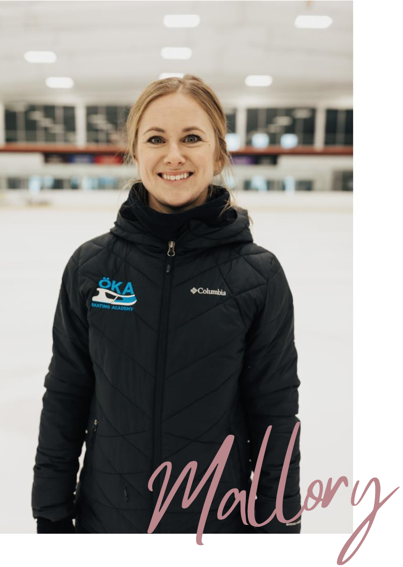 Woman wearing a black jacket smiles on an ice rink.