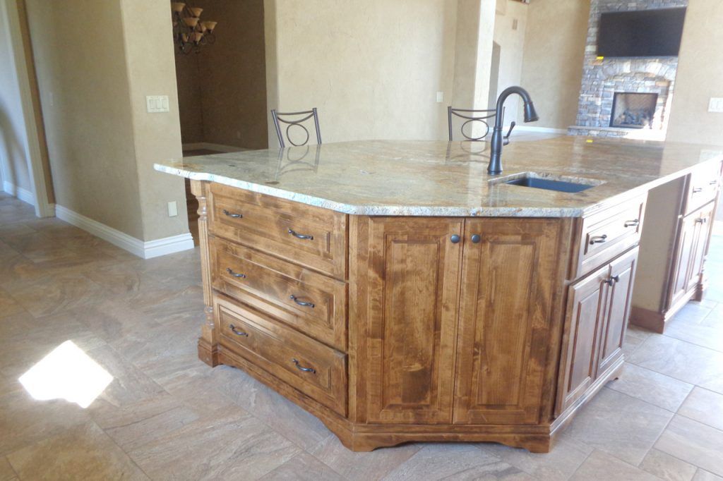 Kitchen With Wooden Cabinets And A Table And Chairs — Willard, MO — Bill’s Custom Woodworks