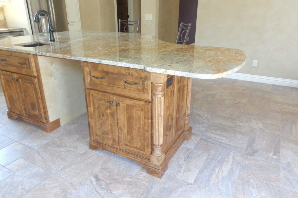 Kitchen Island With A Granite Countertop And Wooden Cabinets — Willard, MO — Bill’s Custom Woodworks
