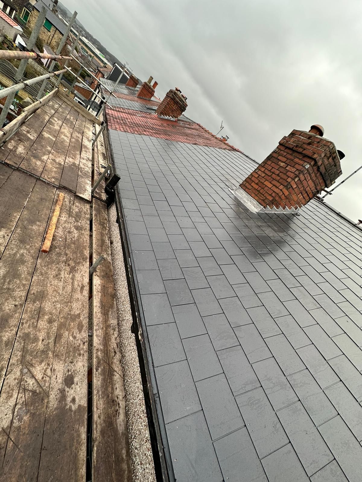 Roofers in Leeds - replacement of roof flashing around a chimney stack.