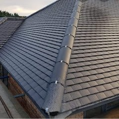 A picture of a hip roof replacement by Hightop Roofers Lees