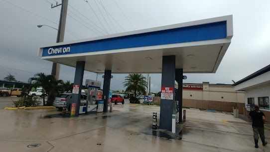 A gas station with a blue sign that says chevron on it