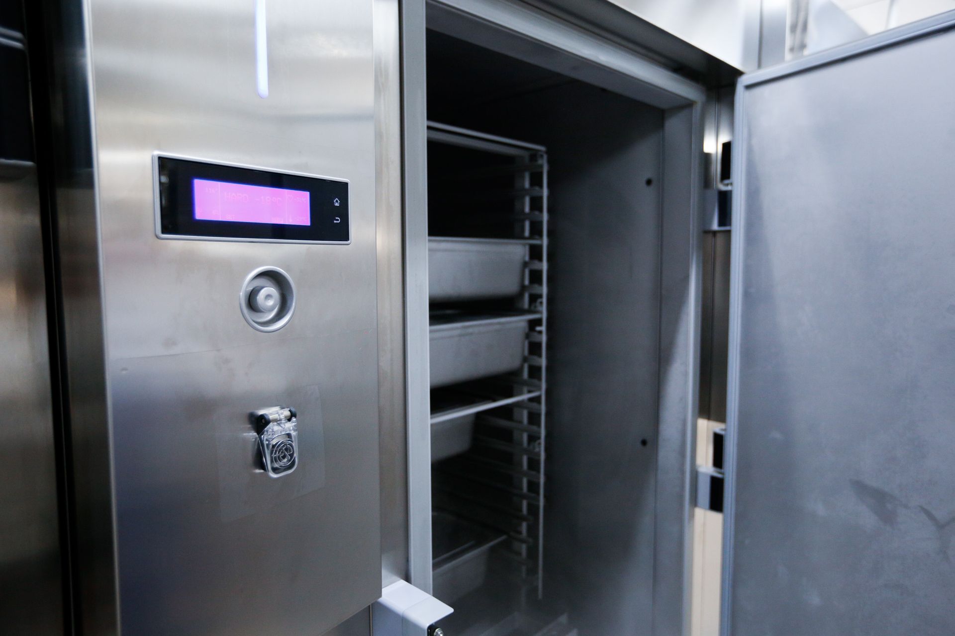 Stainless Steel Refrigerated Cabinet, Partially Open, with Empty Trays Inside — Gilmour Air & Electrical in Parkes, NSW