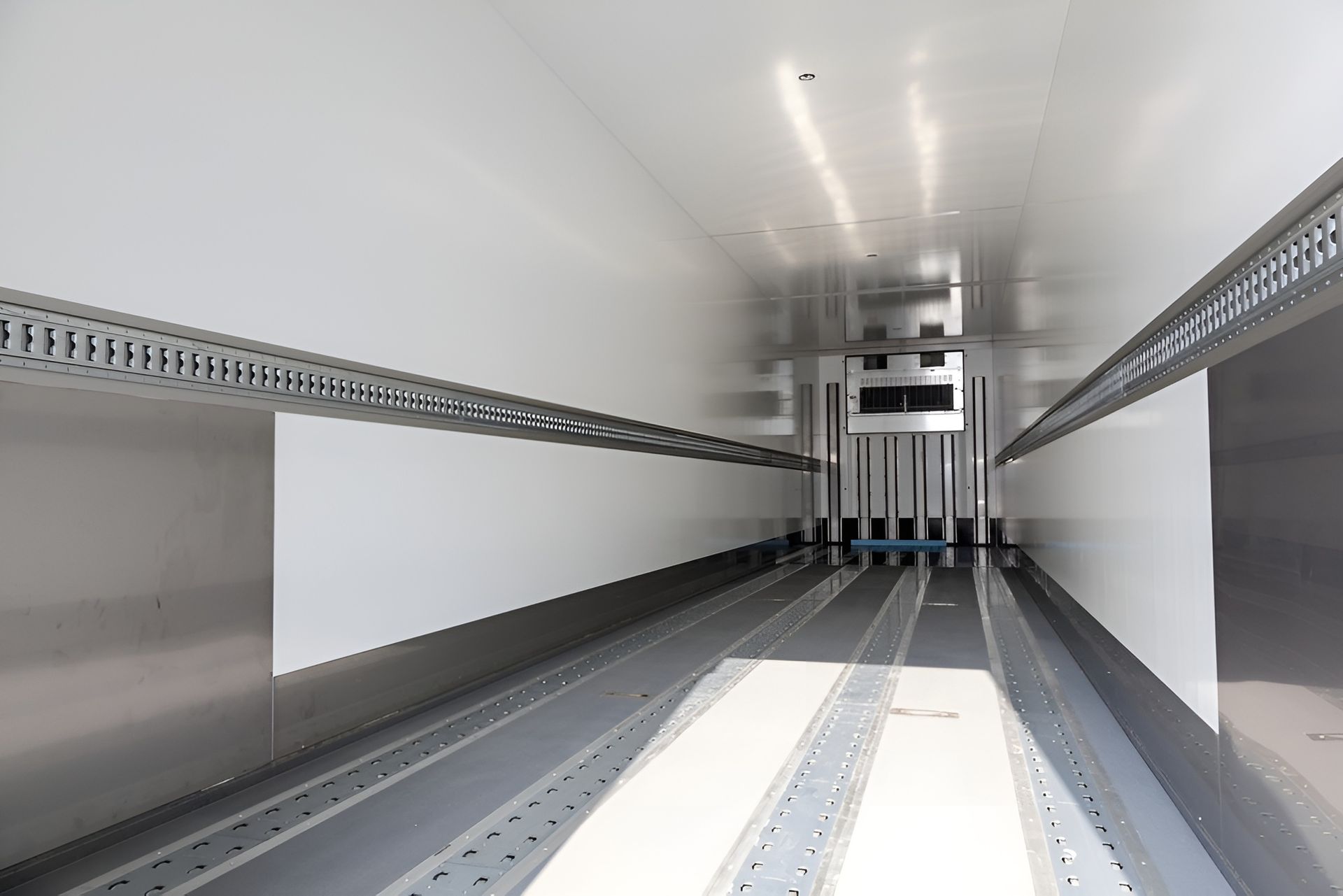 Interior of A Refrigerated Truck Trailer with White Walls and Metal Floor — Gilmour Air & Electrical in Coonamble, NSW