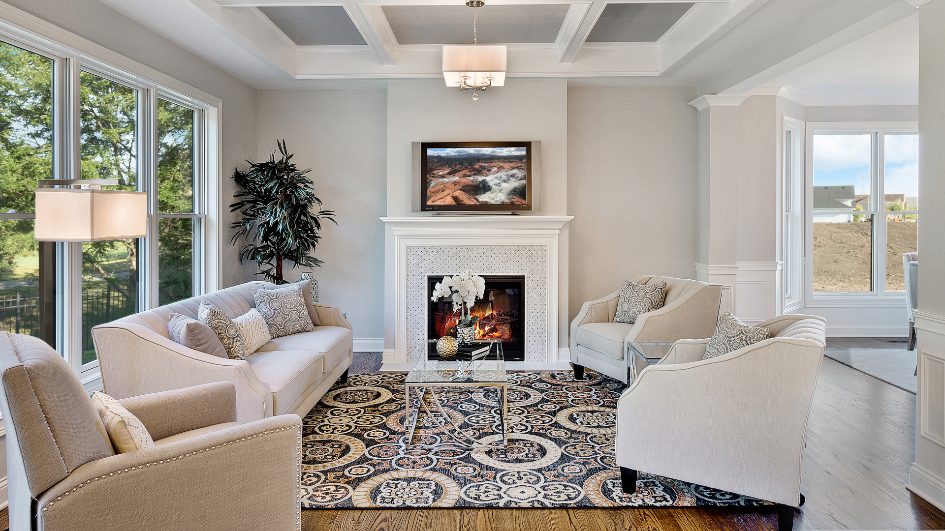 A living room filled with furniture and a fireplace.
