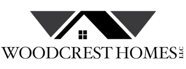A black and white logo for woodcrest homes.