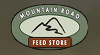 Logo for Mountain Road Feed Store: Oval frame with text and mountain graphic.