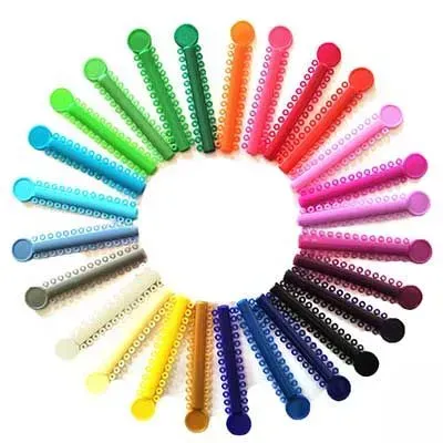 A bunch of different colored rubber bands are arranged in a circle.