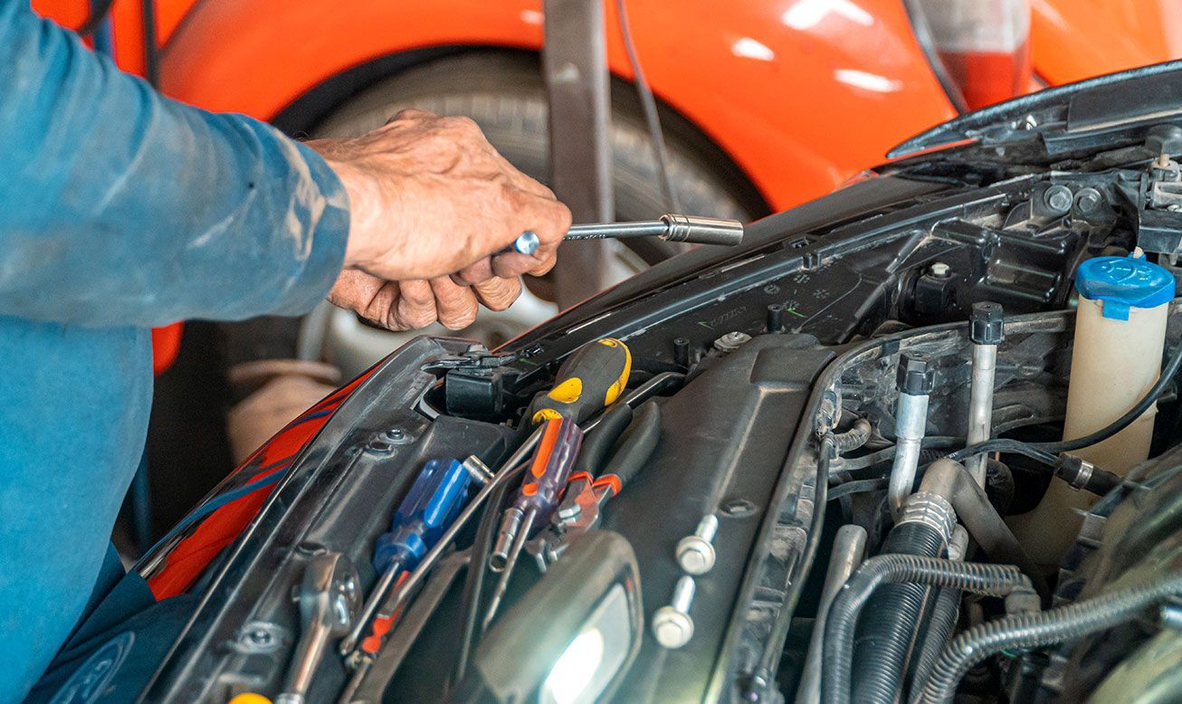 Mechanic Working on a Car Engine | On The Go Garage