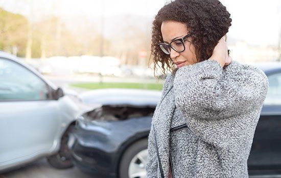 Car Accidents — Woman Waiting for Auto Repair Team in Traverse City, MI