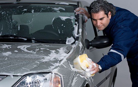 Car Cleaning — Man Washing the Car in Traverse City, MI