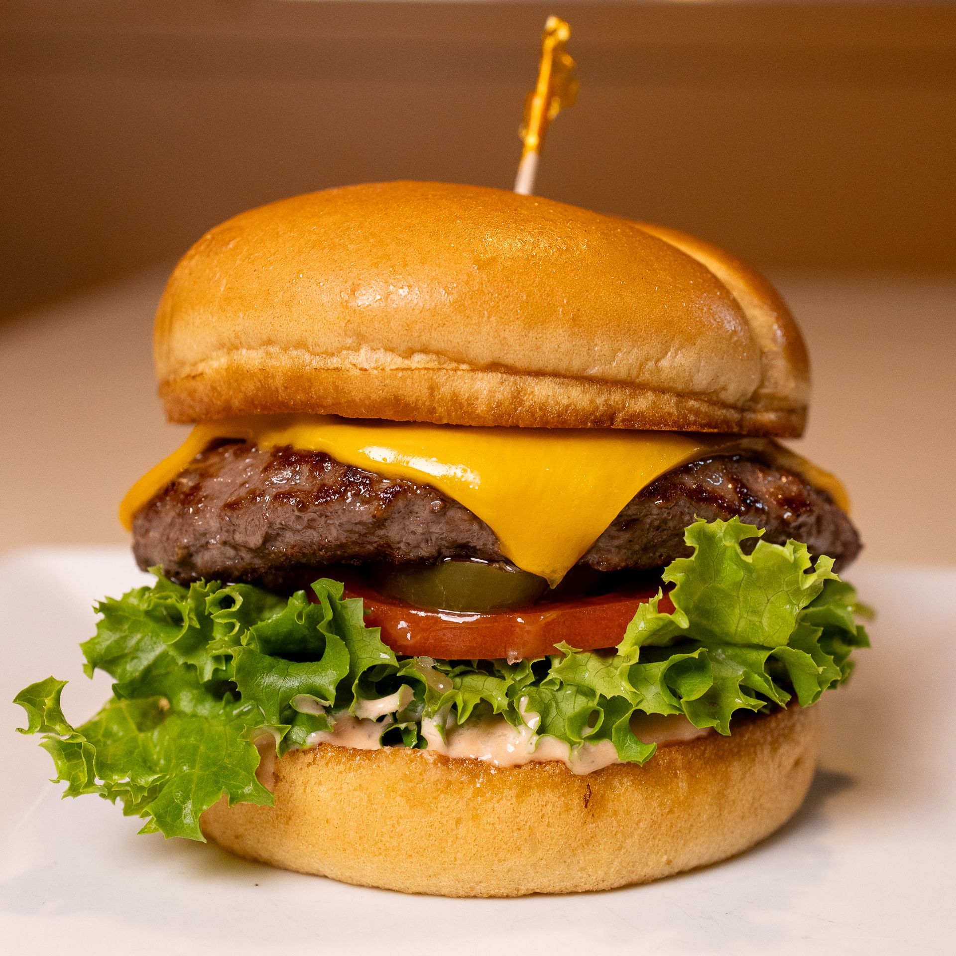 HOMEMADE BANGIN' BREWTERS SAUCE | LETUCE | TOMATO | PICKLE | AMERICAN CHEESE | ONION