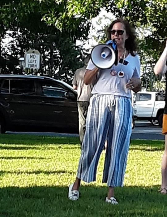 Senator Hoffner with a megaphone outside