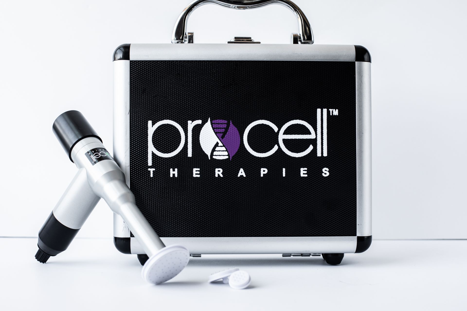 Silver and black medical device with case, 