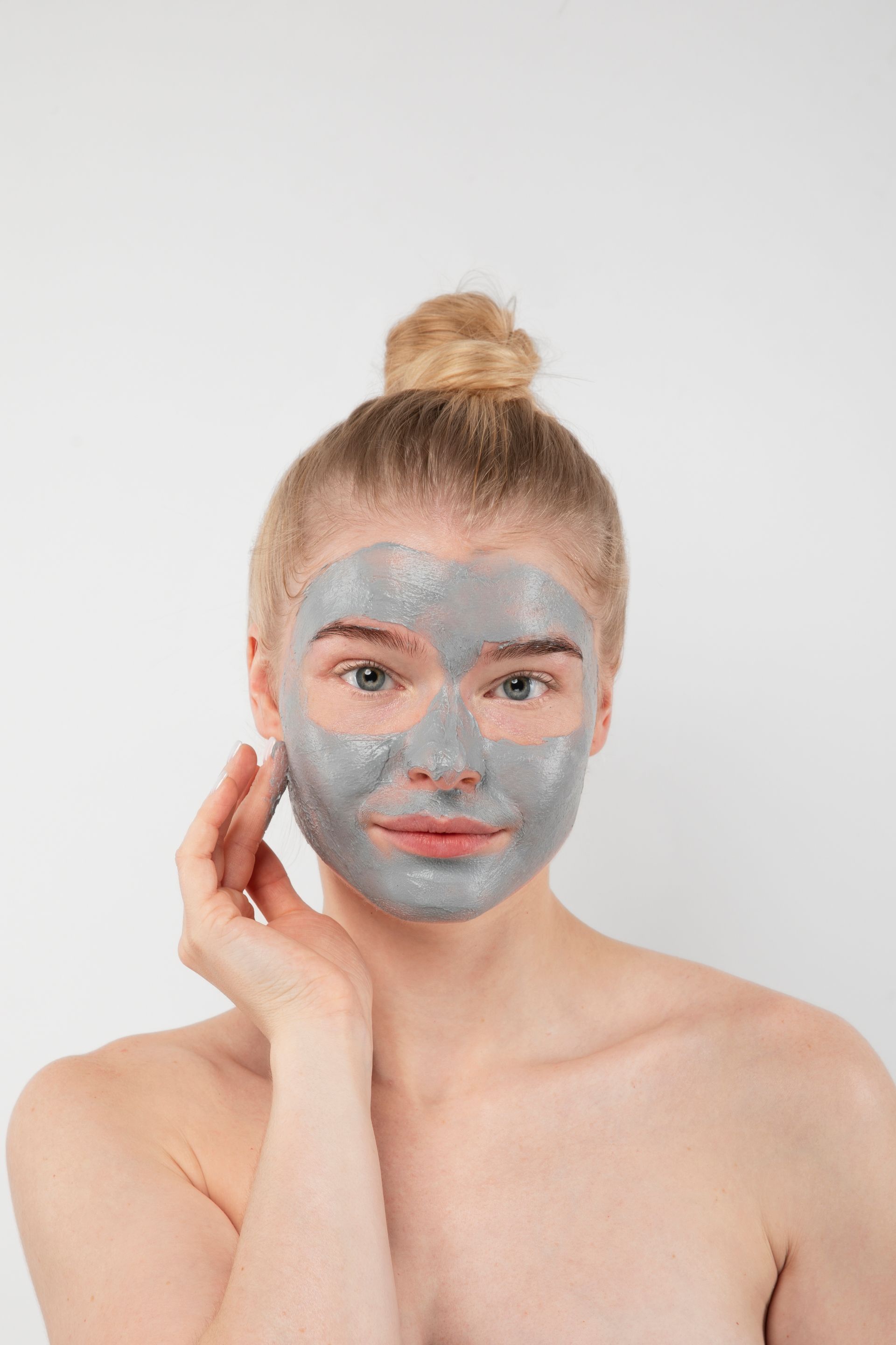 A woman with a grey face mask