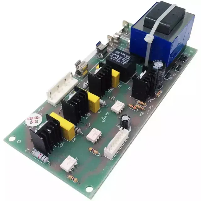 Electronic circuit board with blue transformer, black components, and white connectors on a green PCB