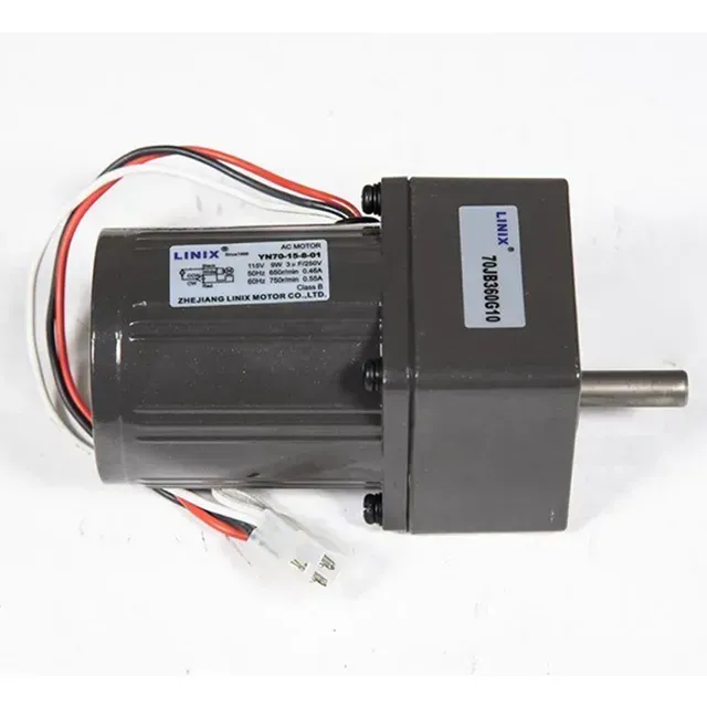 Black electric motor with attached gearbox and protruding metal shaft, white wires visible.