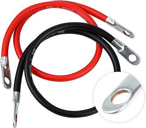Red and black battery jumper cables with metal clamps, shown coiled on a white background.