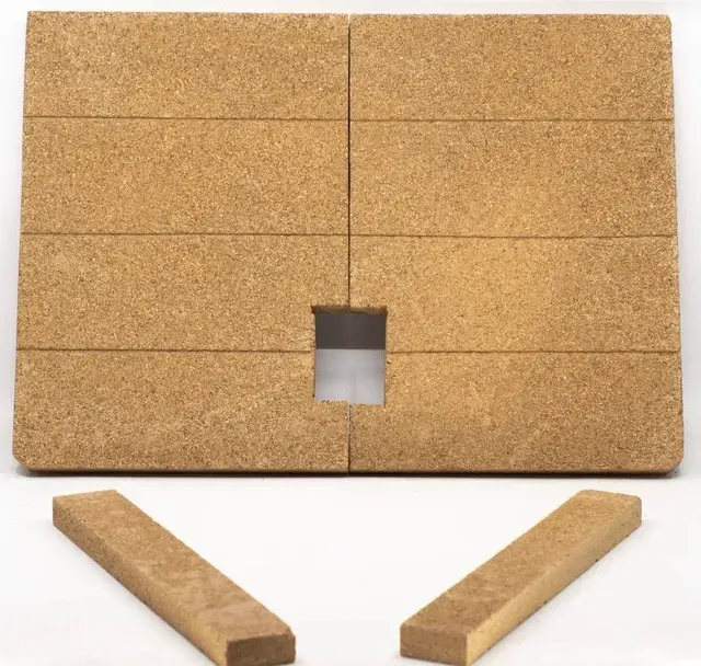 Corkboard with a square cutout and two loose wooden strips below it