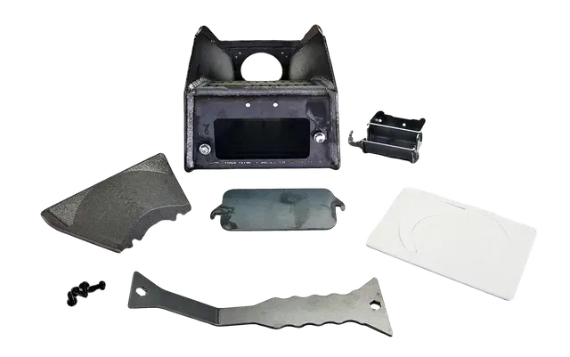 Assorted black and white plastic and metal parts laid out on a white background