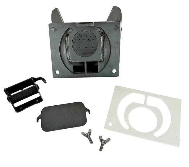 Gray plastic electronic vent kit with filter, cover plate, and small mounting clips on a white background