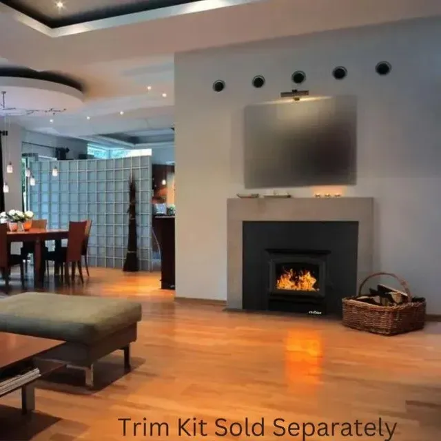 Modern living room with fireplace, wall-mounted TV, and warm wood floors; text reads “Trim Kit Sold Separately”
