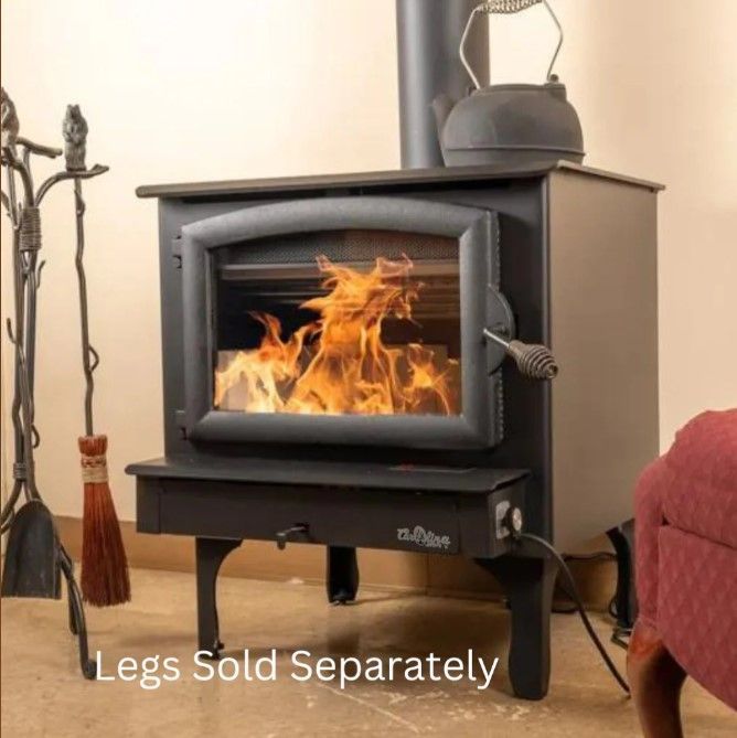 Wood-burning stove with a fire, black metal body, and text reading “Legs Sold Separately”