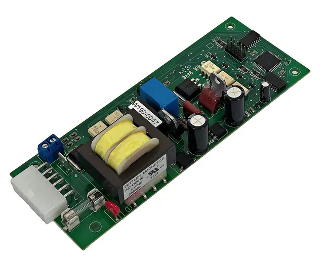 Green circuit board with transformer and electronic components on a white background